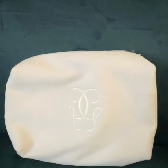 GUERLAIN Handbags - NWT Guerlain Monogrammed Velvet Pouch